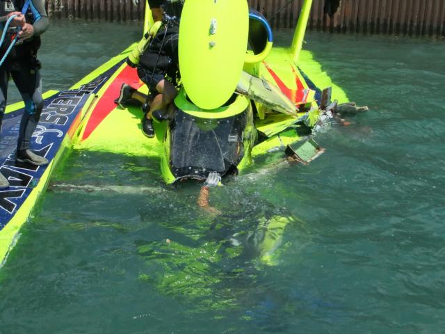 U-37 with diver inspecting the underwater damage